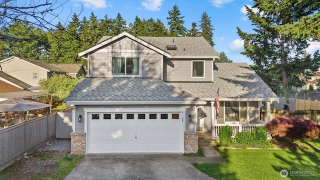20111 74th Avenue Ct E, Spanaway, WA 98387 - traditional-style home featuring roof with shingles, driveway, covered porch, and a garage