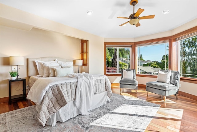 3276 Spyglass Dr, Bellingham, WA 98226 - bedroom featuring multiple windows, wood finished floors, recessed lighting, baseboards, and a ceiling fan