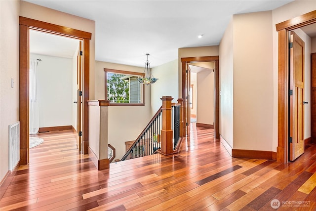 3276 Spyglass Dr, Bellingham, WA 98226 - corridor featuring an upstairs landing, wood-type flooring, and baseboards