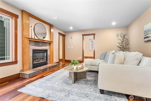 3276 Spyglass Dr, Bellingham, WA 98226 - living room featuring wood finished floors, a tiled fireplace, and recessed lighting