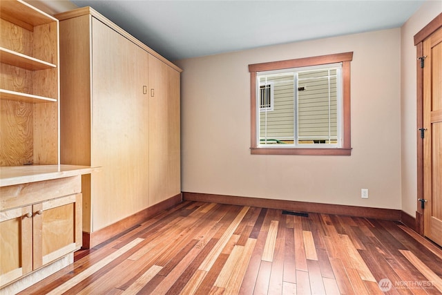 3276 Spyglass Dr, Bellingham, WA 98226 - unfurnished bedroom with light wood-style flooring and baseboards