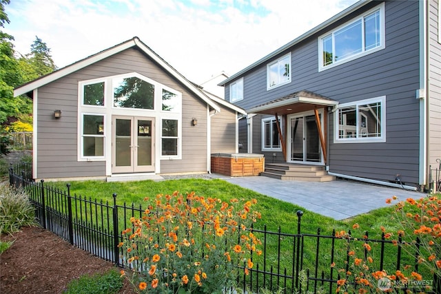 3276 Spyglass Dr, Bellingham, WA 98226 - back of property with a hot tub, a patio area, and entry steps