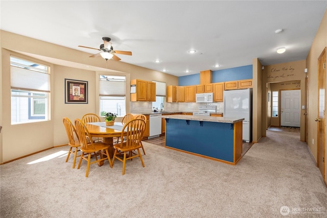 1936 Palisade Blvd, Dupont, WA 98327 - dining area featuring a ceiling fan, baseboards, and light carpet