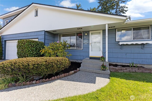 7425 S Alaska St, Tacoma, WA 98408 - view of front of house with an attached garage
