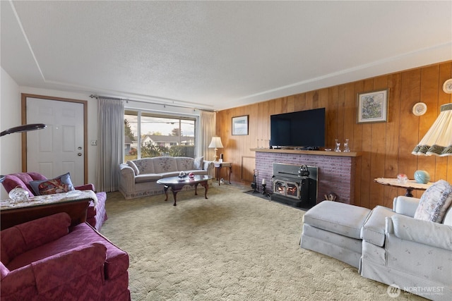 7425 S Alaska St, Tacoma, WA 98408 - carpeted living room featuring wood walls and a textured ceiling
