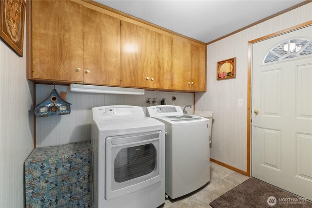 7425 S Alaska St, Tacoma, WA 98408 - washroom with cabinet space, washing machine and clothes dryer, crown molding, baseboards, and light tile patterned floors