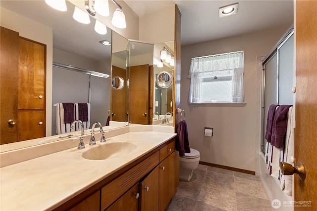 7425 S Alaska St, Tacoma, WA 98408 - full bath featuring vanity, toilet, baseboards, and bath / shower combo with glass door