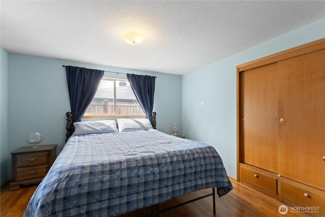 7425 S Alaska St, Tacoma, WA 98408 - bedroom featuring wood finished floors and a textured ceiling