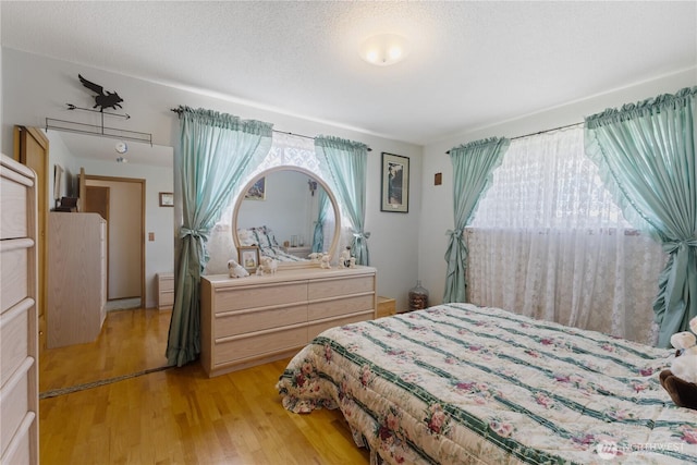 7425 S Alaska St, Tacoma, WA 98408 - bedroom featuring multiple windows and light wood-type flooring