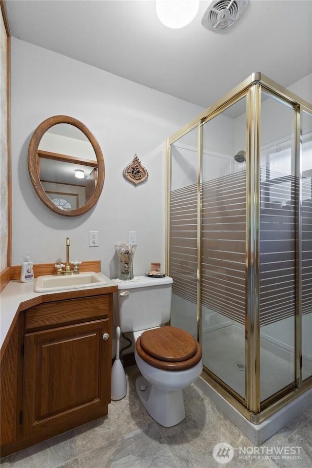 7425 S Alaska St, Tacoma, WA 98408 - bathroom with vanity, toilet, and a stall shower