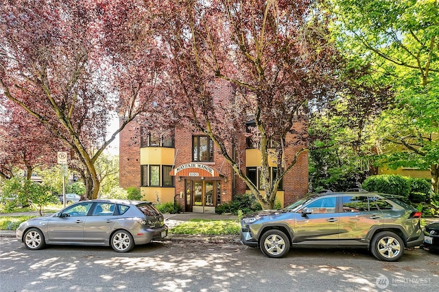1101 17th Ave Unit 403, Seattle, WA 98122 - view of front of home featuring french doors and brick siding