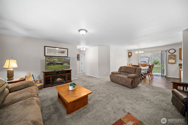 6132 Entiat River Rd, Entiat, WA 98822 - carpeted living area with a chandelier, baseboards, and a lit fireplace