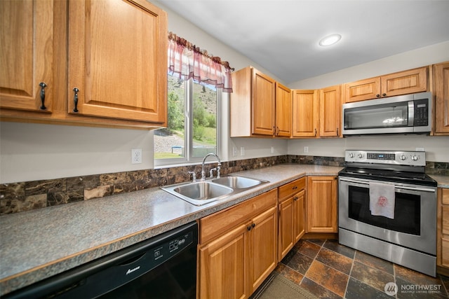 6132 Entiat River Rd, Entiat, WA 98822 - kitchen with appliances with stainless steel finishes, a sink, dark stone finish floors, recessed lighting, and dark countertops