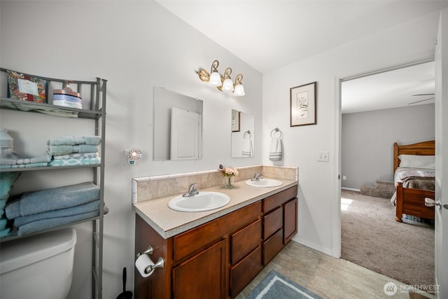 6132 Entiat River Rd, Entiat, WA 98822 - bathroom with double vanity, toilet, ensuite bathroom, and baseboards