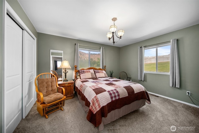 6132 Entiat River Rd, Entiat, WA 98822 - bedroom featuring multiple windows, carpet floors, a closet, and baseboards