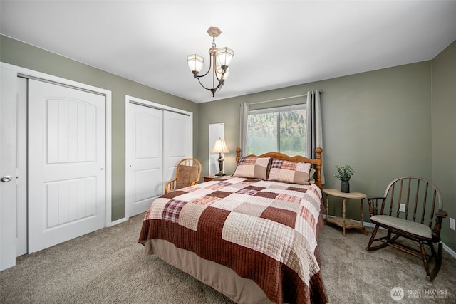 6132 Entiat River Rd, Entiat, WA 98822 - carpeted bedroom with two closets, a chandelier, and baseboards
