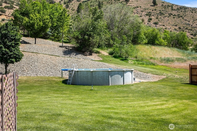 6132 Entiat River Rd, Entiat, WA 98822 - view of yard with an outdoor pool and a mountain view