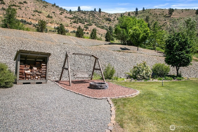 6132 Entiat River Rd, Entiat, WA 98822 - view of green lawn featuring an outdoor fire pit and a mountain view