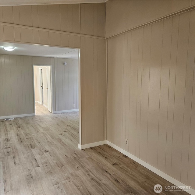 7031 NE 175th St Unit 20, Kenmore, WA 98028 - empty room with wood finished floors, wood walls, and baseboards