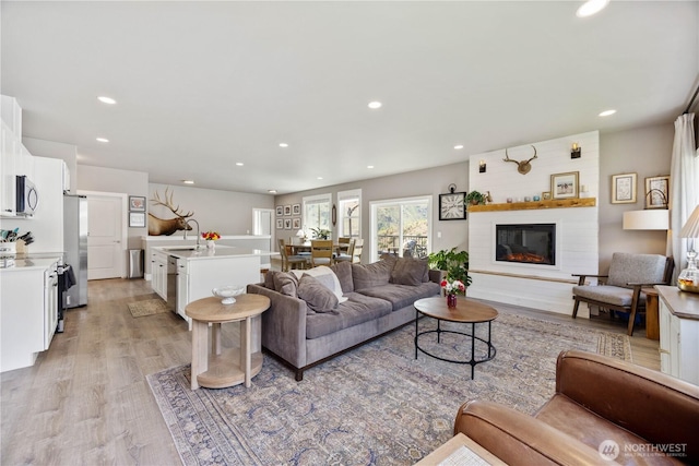 9968 Griffith Pl, Entiat, WA 98822 - living room featuring light wood-style flooring, recessed lighting, and a large fireplace