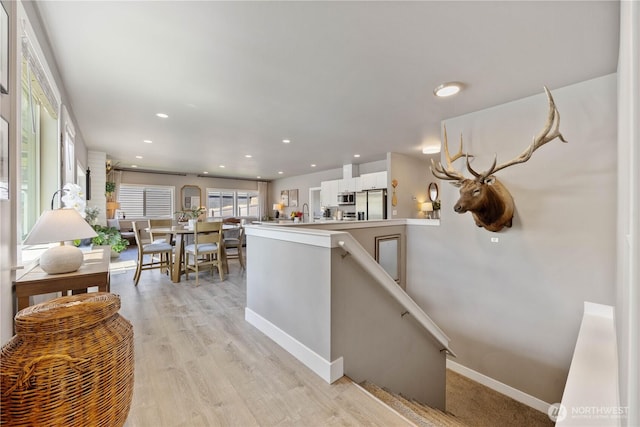 9968 Griffith Pl, Entiat, WA 98822 - kitchen featuring stainless steel appliances, white cabinets, recessed lighting, baseboards, and light wood-type flooring