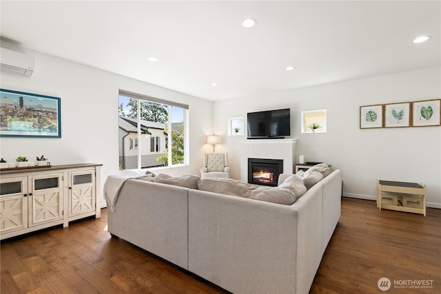 2736 SW Holden St, Seattle, WA 98126 - living area featuring a wall mounted air conditioner, a glass covered fireplace, dark wood-type flooring, and recessed lighting