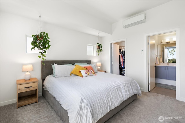 2736 SW Holden St, Seattle, WA 98126 - bedroom with a wall mounted AC, light colored carpet, a spacious closet, ensuite bath, and a closet
