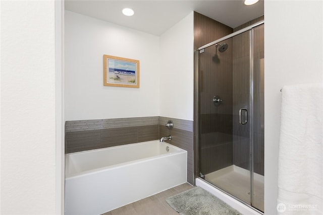 2736 SW Holden St, Seattle, WA 98126 - bathroom featuring a garden tub, a shower stall, wood finished floors, and recessed lighting