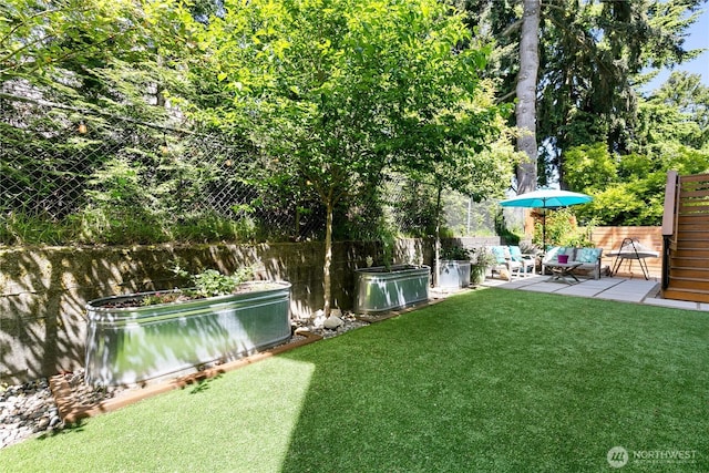 2736 SW Holden St, Seattle, WA 98126 - view of yard with a vegetable garden and a patio area