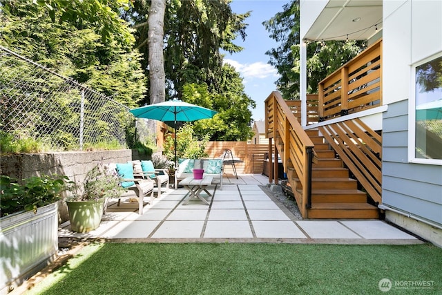 2736 SW Holden St, Seattle, WA 98126 - fenced backyard with outdoor lounge area, a patio area, and stairs