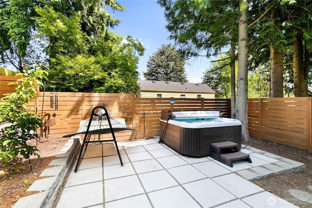 2736 SW Holden St, Seattle, WA 98126 - fenced backyard with a hot tub and a patio area