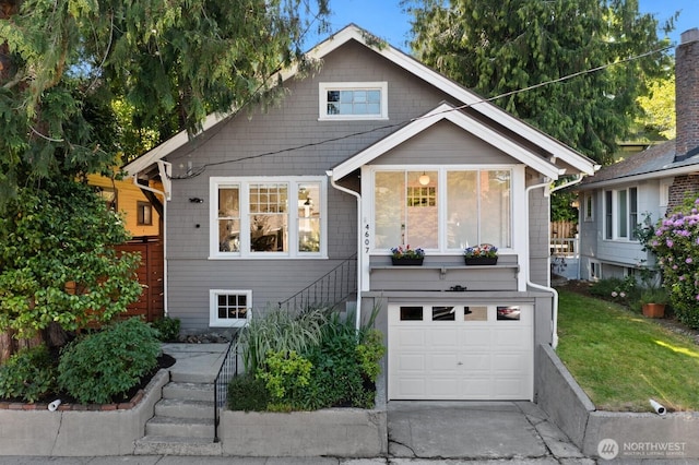 4607 1st Ave NE, Seattle, WA 98105 - view of front of house with stairway, a garage, and driveway