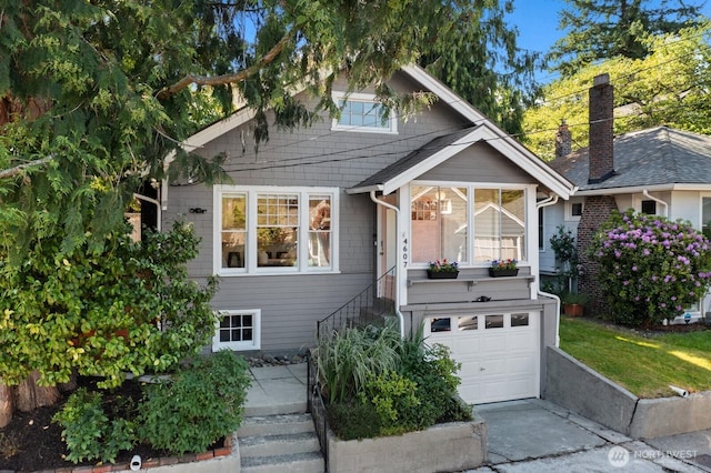 4607 1st Ave NE, Seattle, WA 98105 - view of front of property with stairway, a garage, and concrete driveway