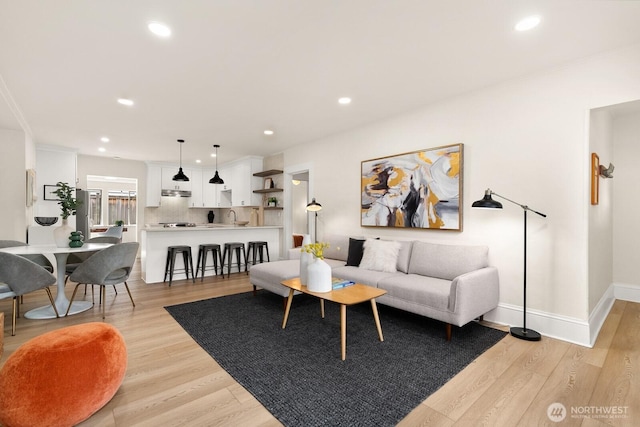 4607 1st Ave NE, Seattle, WA 98105 - living room with light wood finished floors, recessed lighting, and baseboards