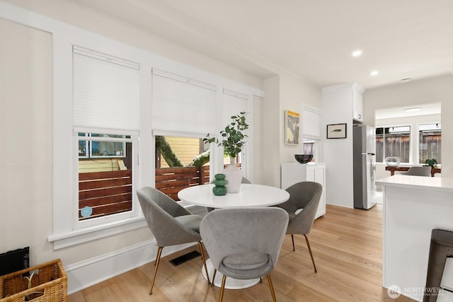 4607 1st Ave NE, Seattle, WA 98105 - dining space with light wood-style flooring, recessed lighting, and baseboards