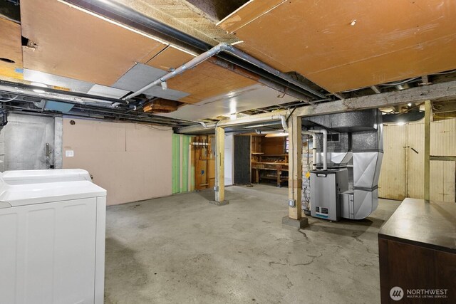 4607 1st Ave NE, Seattle, WA 98105 - unfinished below grade area featuring separate washer and dryer and heating unit