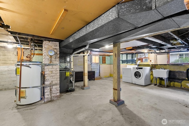 4607 1st Ave NE, Seattle, WA 98105 - below grade area featuring water heater, independent washer and dryer, and a sink
