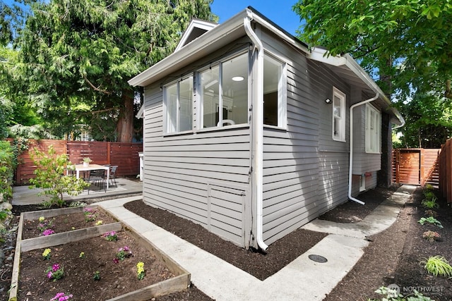 4607 1st Ave NE, Seattle, WA 98105 - view of side of property featuring a vegetable garden and a patio area