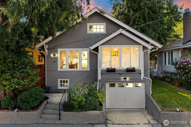 4607 1st Ave NE, Seattle, WA 98105 - view of front of property featuring a garage, stairway, and concrete driveway