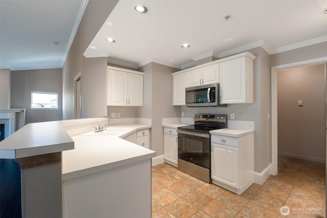 2198 Palisade Blvd Unit C2, Dupont, WA 98372 - kitchen featuring stainless steel appliances, a sink, a peninsula, white cabinetry, and recessed lighting