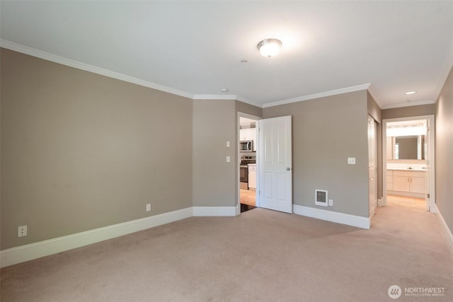 2198 Palisade Blvd Unit C2, Dupont, WA 98372 - unfurnished bedroom featuring baseboards, light colored carpet, ornamental molding, connected bathroom, and recessed lighting