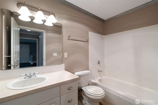 2198 Palisade Blvd Unit C2, Dupont, WA 98372 - bathroom featuring ornamental molding, vanity, toilet, and bathtub / shower combination