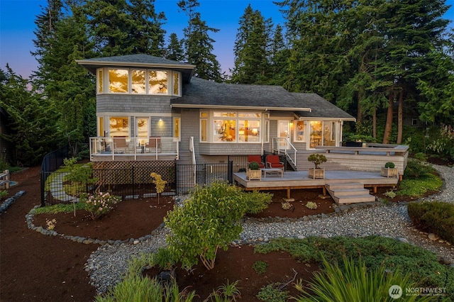 2 Edgewater Dr, Camano Island, WA 98282 - back of property at dusk with a deck and roof with shingles