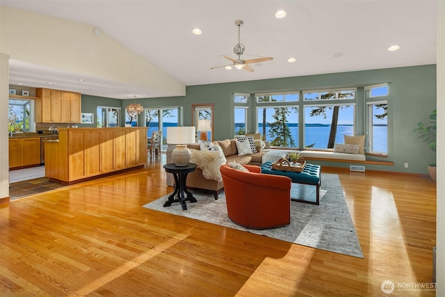 2 Edgewater Dr, Camano Island, WA 98282 - living area with light wood-style flooring, a ceiling fan, recessed lighting, plenty of natural light, and vaulted ceiling