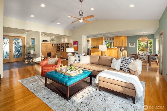 2 Edgewater Dr, Camano Island, WA 98282 - living room with vaulted ceiling, wood finished floors, a ceiling fan, recessed lighting, and french doors