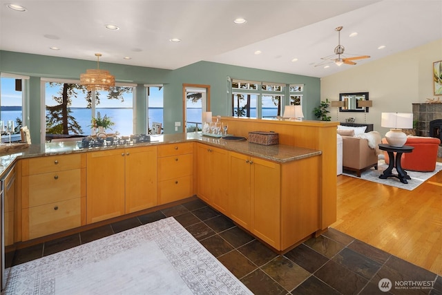 2 Edgewater Dr, Camano Island, WA 98282 - kitchen featuring light brown cabinetry, recessed lighting, light stone countertops, hanging light fixtures, and a chandelier