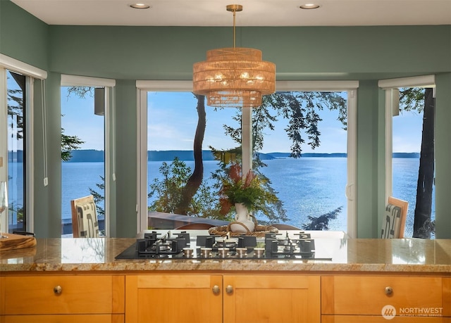 2 Edgewater Dr, Camano Island, WA 98282 - kitchen with a water view, plenty of natural light, gas stovetop, light stone countertops, and recessed lighting