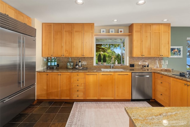 2 Edgewater Dr, Camano Island, WA 98282 - kitchen with stainless steel appliances, decorative backsplash, light stone countertops, dark tile patterned floors, and recessed lighting