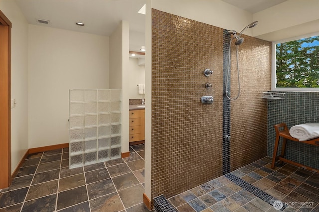 2 Edgewater Dr, Camano Island, WA 98282 - full bathroom featuring a tile shower, vanity, and tile walls