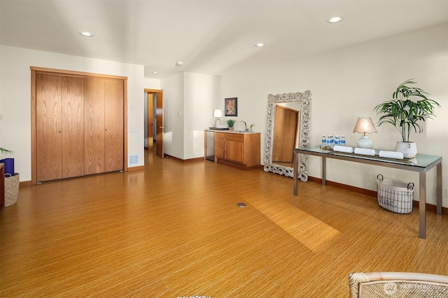 2 Edgewater Dr, Camano Island, WA 98282 - bedroom featuring recessed lighting, wood finished floors, and bar with sink
